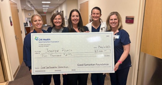 Last year, Jenifer Roach, RN (middle), surrounded by co-workers in the hospital’s Wound Center, displayed a large check for a $2,000 Good Samaritan Health Care Career Scholarship awarded through the Foundation